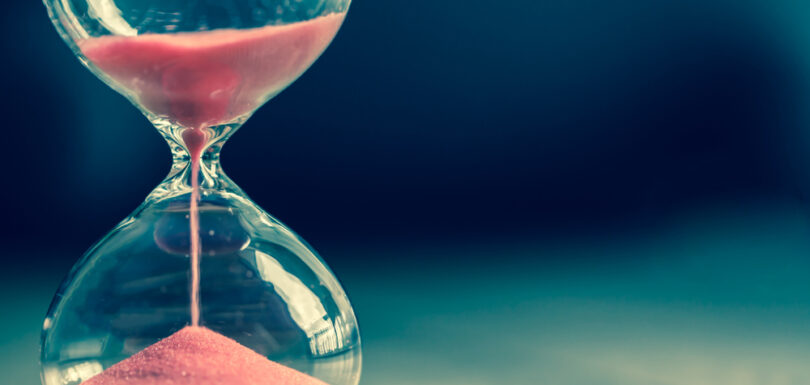 an hourglass with sand on top of it